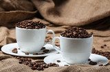 Two coffee cups with coffee beans.  Kawa Fototapeta