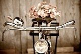 Old bicycle and flower  vase  Pojazdy Fototapeta