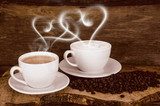 Coffee beans and coffee cup with heart- shaped steam  Kawa Fototapeta