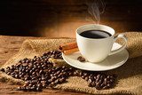 Coffee cup and coffee beans on old wooden background  Kawa Fototapeta