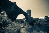 medieval stone bridge over river. Imitation of old image  Fototapety Mosty Fototapeta