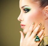Glamour woman with beautiful golden nails and emerald ring  Ludzie Obraz
