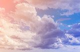 White clouds with blue sky background. Color toned image.  Niebo Fototapeta