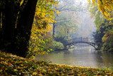 Autumn - Old bridge in autumn misty park  Fototapety Mosty Fototapeta