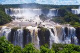 Beautiful Cascade of waterfalls with clouds and jungle. Iguassu  Fototapety Wodospad Fototapeta