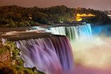 Niagara Falls lit at night by colorful lights  Fototapety Wodospad Fototapeta