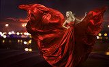 woman dancing in silk dress, artistic red blowing gown waving  Ludzie Plakat