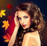 Girl with colourful autumn leaves hairstyle and makeup  Ludzie Plakat