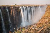 Silk water in Victoria Falls, View from Zimbabwe  Fototapety Wodospad Fototapeta