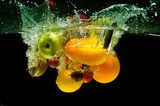 Fruit and vegetables splash into water  Obrazy do Kuchni  Obraz