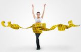 Fit young woman with a large measuring tape  Fototapety do Klubu Fitness Fototapeta