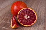 red blood sicilian orange whole, half and wedge  Owoce Obraz