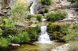 Nice waterfalls following each other over granite  Fototapety Wodospad Fototapeta
