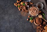 Black food background with cocoa, nuts and chocolate paste.  Obrazy do Jadalni Obraz