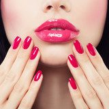 Makeup Lips with Pink Glossy Lipstick and Pink Nails. Shiny Lips and Hand with Manicure Obrazy do Salonu Kosmetycznego Obraz