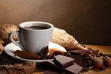 coffee cup and beans, cinnamon sticks, nuts and chocolate  Kawa Fototapeta