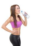 Fit young woman drinking water during workout  Fototapety do Klubu Fitness Fototapeta