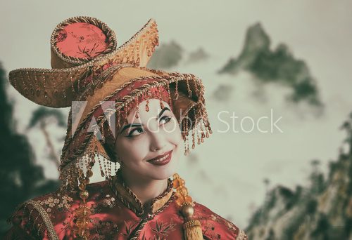 Portrait of a smiling woman in Chinese princess costume  Orientalne Fototapeta