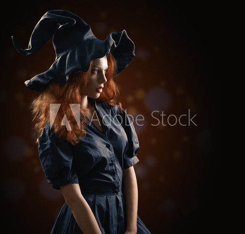 beautiful red-haired girl in the witch costume  Ludzie Obraz