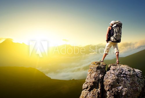 Tourist on rock. Sport and active life concept  Ludzie Plakat