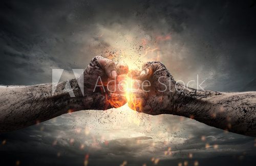 Fight, two fists hitting each other over dramatic sky  Ludzie Plakat