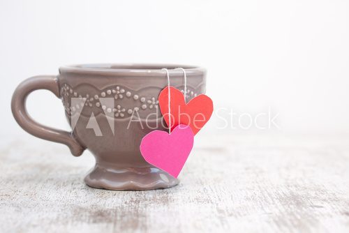 cup with heart shaped tea bag  Obrazy do Kuchni  Obraz