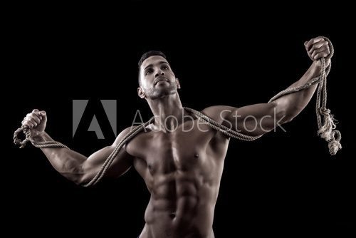 muscled man on a black background  Fototapety do Klubu Fitness Fototapeta
