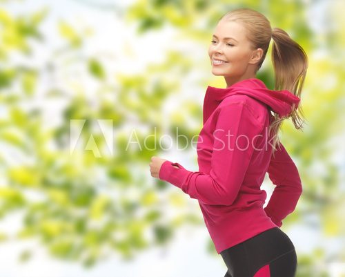 happy woman running or jogging  Fototapety do Klubu Fitness Fototapeta