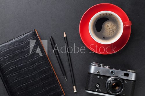 Desk with camera, supplies and coffee cup Plakaty do Biura Plakat
