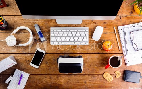 Desk with various gadgets and office supplies. Flat lay Plakaty do Biura Plakat