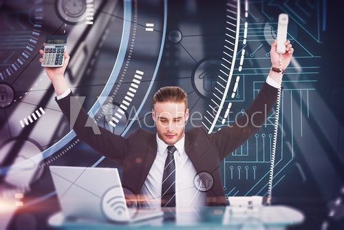 Composite image of businessman cheering holding calculator Plakaty do Biura Plakat