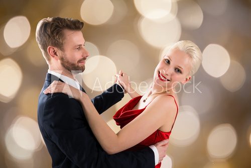 Young Couple Dancing On Bokeh Background Fototapety do Szkoły Tańca Fototapeta