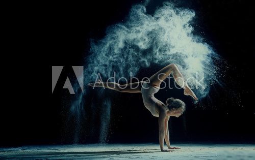 Graceful woman dancing in cloud of dust Fototapety do Szkoły Tańca Fototapeta