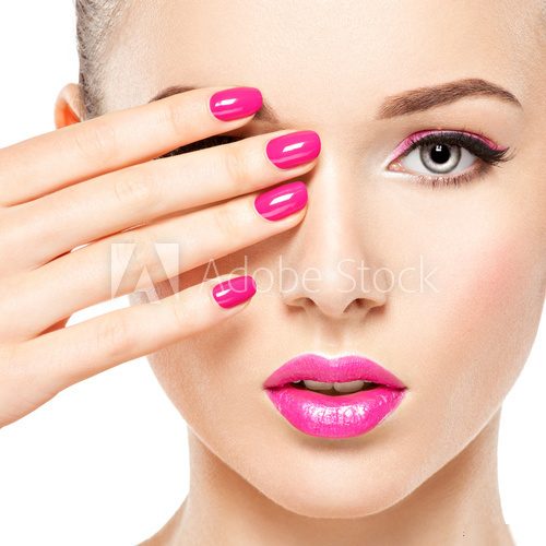 eautiful woman face with pink makeup of eyes and nails. Obrazy do Salonu Kosmetycznego Obraz