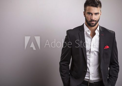 Elegant young handsome man. Studio fashion portrait.  Ludzie Plakat