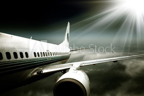 the airplane with the blue sky background.  Fototapety Czarno-Białe Fototapeta