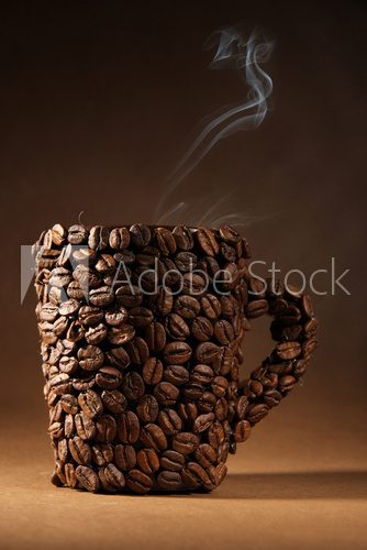 Cup of coffee beans with smoke on brown background  Fototapety do Kawiarni Fototapeta