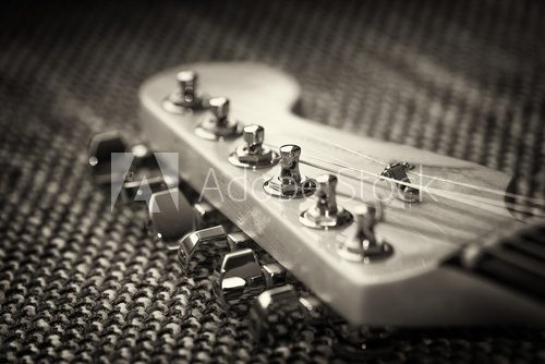 Electrical guitar headstock closeup. Sepia effect with vignette  Muzyka Obraz