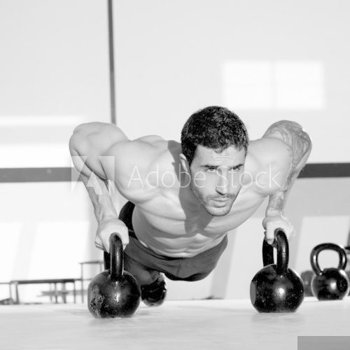 Gym man push-up strength pushup with Kettlebell  Fototapety do Siłowni Fototapeta