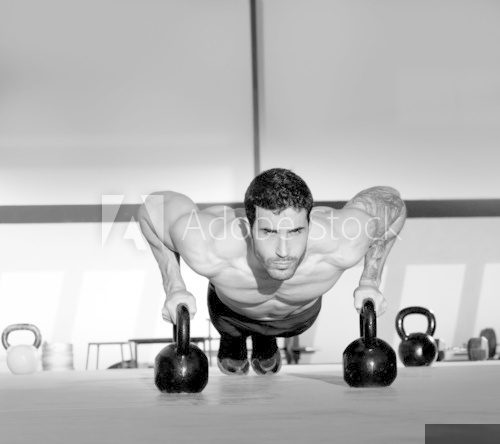 Gym man push-up strength pushup with Kettlebell  Fototapety do Siłowni Fototapeta
