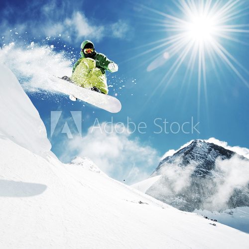 Snowboarder at jump inhigh mountains Plakaty dla Nastolatka Plakat