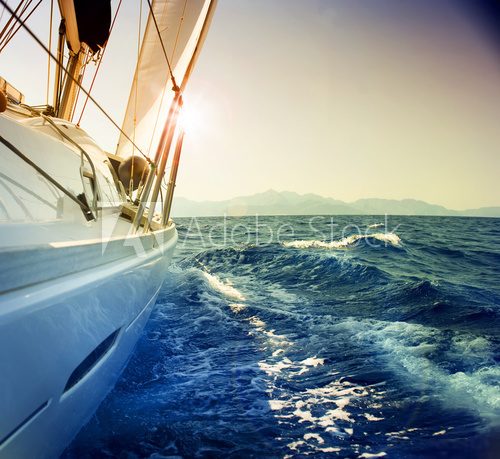 Yacht Sailing against sunsetSailboatSepia toned Plakaty do Biura Plakat