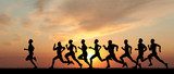 Marathon, black silhouettes of runners on the sunset  Sport Fototapeta