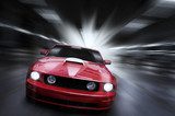 Luxury red sport car speeding in a underground parking  Pojazdy Fototapeta