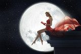 Cute woman over full moon background  Ludzie Plakat