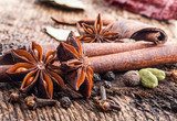 Spices on wooden table  Fototapety do Kawiarni Fototapeta