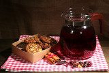Jar of herbal tea and cookies on wooden table  Fototapety do Kawiarni Fototapeta