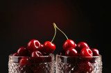 Sweet cherries in glasses on dark background  Plakaty do kuchni Plakat