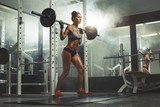 Woman lifting weight in gym  Sport Plakat