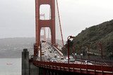close up of Golden Gate Bridge with traffic on it  Fototapety Mosty Fototapeta